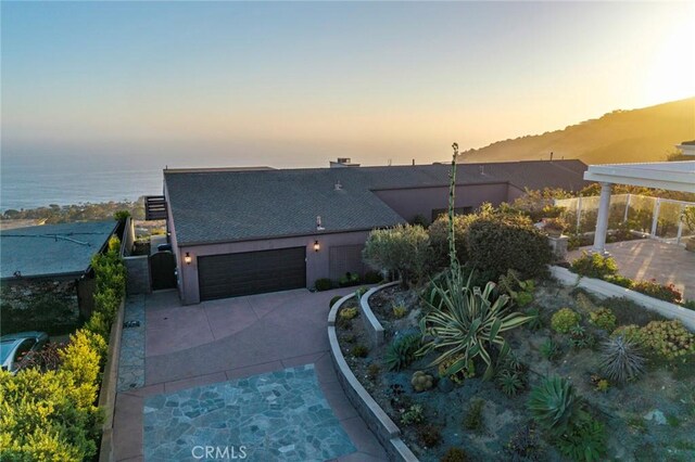 32131 Sea Island Dr, Dana Point, CA 92629 - contemporary house featuring concrete driveway, an attached garage, and roof with shingles