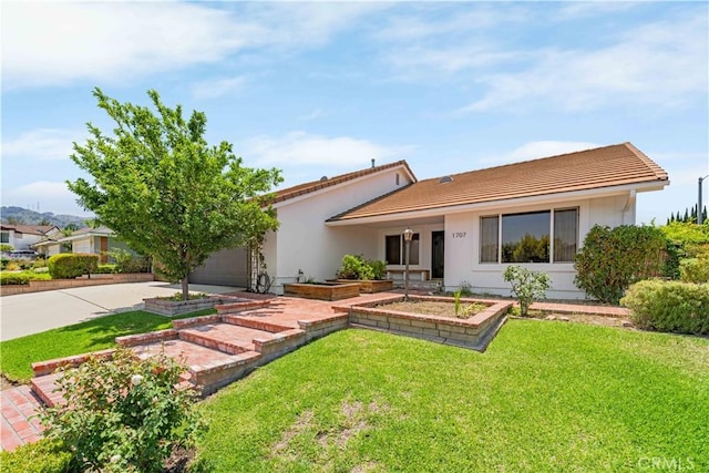 1707 Gay Park Way, Hacienda Heights, CA 91745 - ranch-style house featuring concrete driveway, a tiled roof, a front yard, and a garage