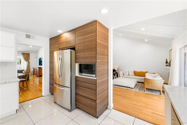 1707 Gay Park Way, Hacienda Heights, CA 91745 - kitchen featuring freestanding refrigerator, modern cabinets, light stone countertops, light tile patterned floors, and recessed lighting