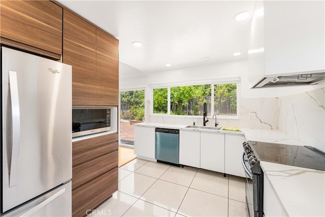 1707 Gay Park Way, Hacienda Heights, CA 91745 - kitchen featuring freestanding refrigerator, stainless steel electric stove, dishwasher, premium range hood, and white cabinetry