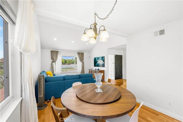 1707 Gay Park Way, Hacienda Heights, CA 91745 - dining room featuring vaulted ceiling, wood finished floors, a chandelier, and recessed lighting