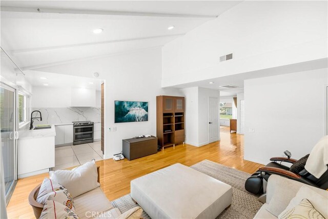 1707 Gay Park Way, Hacienda Heights, CA 91745 - living room with beamed ceiling, light wood-style flooring, recessed lighting, and high vaulted ceiling