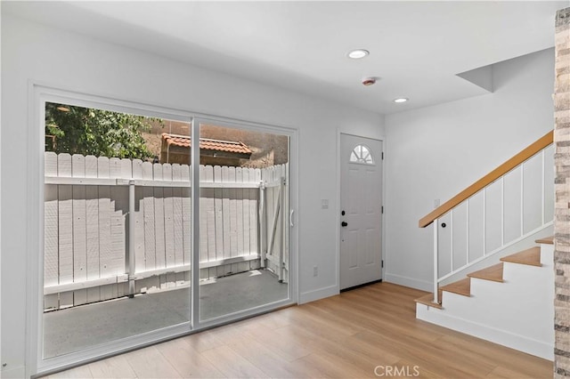 9019 Cedros Ave Unit 2, Panorama City, CA 91402 - foyer featuring wood finished floors, plenty of natural light, stairway, and recessed lighting