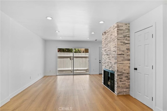 9019 Cedros Ave Unit 2, Panorama City, CA 91402 - unfurnished living room featuring a fireplace, light wood-style floors, and recessed lighting