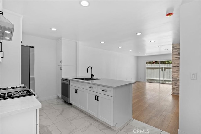 9019 Cedros Ave Unit 2, Panorama City, CA 91402 - kitchen with stainless steel dishwasher, white cabinetry, open floor plan, recessed lighting, and exhaust hood