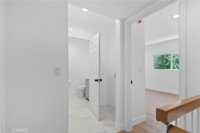9019 Cedros Ave Unit 2, Panorama City, CA 91402 - corridor featuring light marble finish floors and recessed lighting