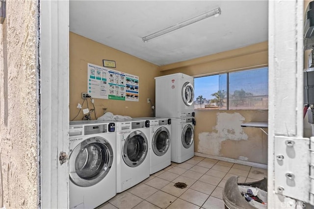 9019 Cedros Ave Unit 2, Panorama City, CA 91402 - shared laundry featuring stacked washing machine and dryer, washing machine and clothes dryer, and light tile patterned flooring