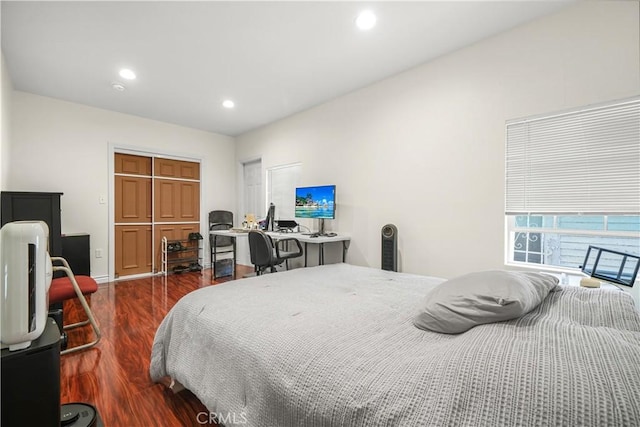 1067 N Wilton Pl, Los Angeles, CA 90038 - bedroom with dark wood-style flooring, recessed lighting, a closet, and an office area