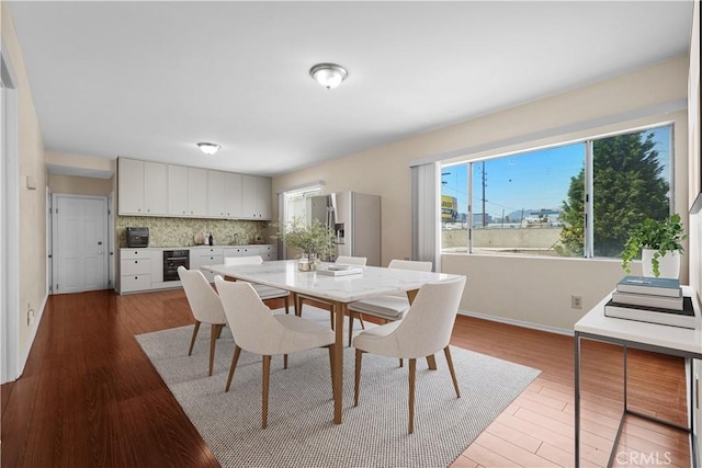 1067 N Wilton Pl, Los Angeles, CA 90038 - dining room with wood finished floors and baseboards