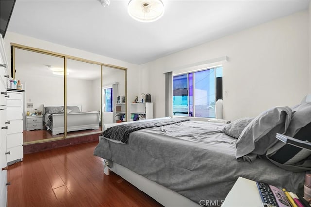 1067 N Wilton Pl, Los Angeles, CA 90038 - bedroom featuring wood finished floors and a closet