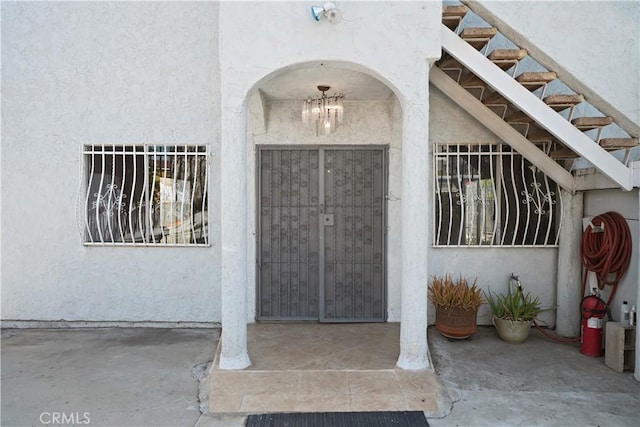 1067 N Wilton Pl, Los Angeles, CA 90038 - view of exterior entry featuring stucco siding