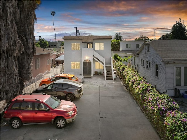 1067 N Wilton Pl, Los Angeles, CA 90038 - view of front of home featuring stairway and stucco siding