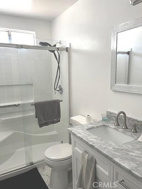 235 S 2nd St, Shandon, CA 93461 - full bath with a shower stall, vanity, and marble finish flooring