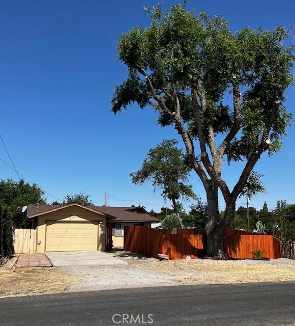 235 S 2nd St, Shandon, CA 93461 - single story home with an attached garage and concrete driveway