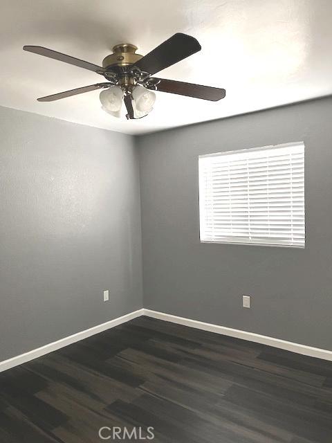 235 S 2nd St, Shandon, CA 93461 - unfurnished room featuring dark wood-style flooring and ceiling fan