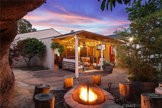 2283 Ximeno Ave, Long Beach, CA 90815 - patio terrace at dusk with a patio and an outdoor living space with a fire pit