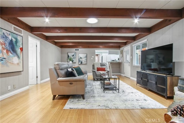 2283 Ximeno Ave, Long Beach, CA 90815 - living room with beam ceiling and light wood-style floors