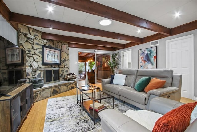 2283 Ximeno Ave, Long Beach, CA 90815 - living area featuring light wood-style floors, beam ceiling, a fireplace, and recessed lighting