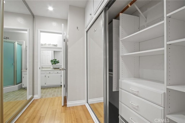2283 Ximeno Ave, Long Beach, CA 90815 - walk in closet with light wood-style flooring