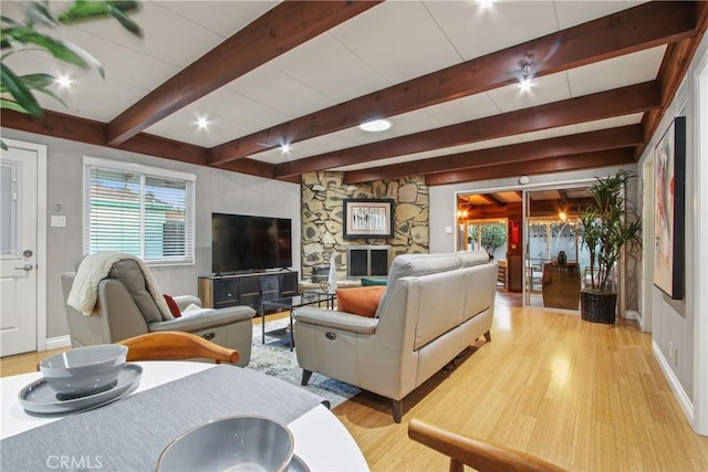2283 Ximeno Ave, Long Beach, CA 90815 - living area featuring light wood-type flooring, beam ceiling, and plenty of natural light