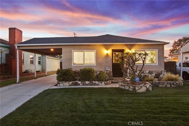 2283 Ximeno Ave, Long Beach, CA 90815 - view of front facade featuring driveway, a carport, stucco siding, and entry steps