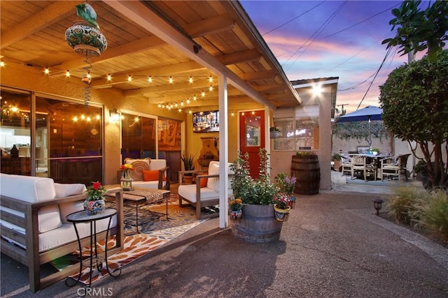 2283 Ximeno Ave, Long Beach, CA 90815 - patio terrace at dusk featuring an outdoor living space, a patio, and outdoor dining space