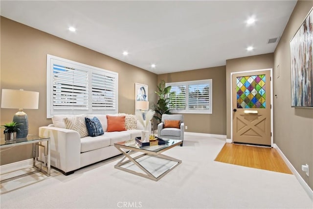 2283 Ximeno Ave, Long Beach, CA 90815 - carpeted living room featuring recessed lighting and wood finished floors
