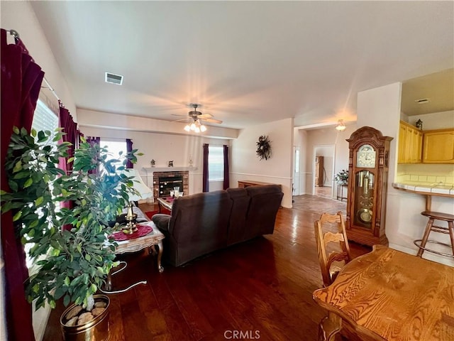 21509 Stage Dr, Tehachapi, CA 93561 - living area featuring wood finished floors, ceiling fan, and a fireplace