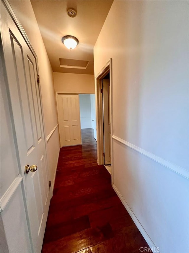 21509 Stage Dr, Tehachapi, CA 93561 - hallway featuring dark wood finished floors and attic access