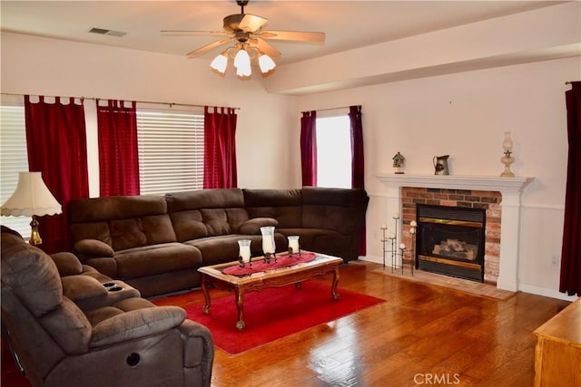 21509 Stage Dr, Tehachapi, CA 93561 - living room with wood finished floors, ceiling fan, and a fireplace