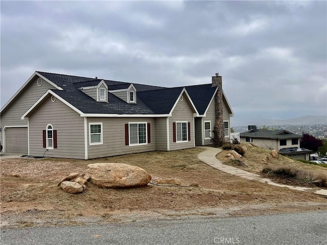 21509 Stage Dr, Tehachapi, CA 93561 - view of front of property featuring a garage and a chimney