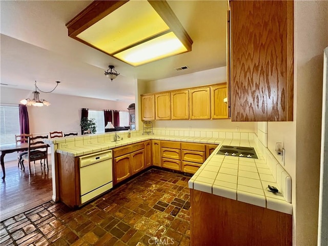 21509 Stage Dr, Tehachapi, CA 93561 - kitchen featuring white dishwasher, electric cooktop, a peninsula, brick flooring, and tile countertops