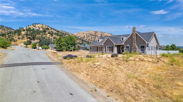 21509 Stage Dr, Tehachapi, CA 93561 - view of front of home featuring a mountain view and a chimney