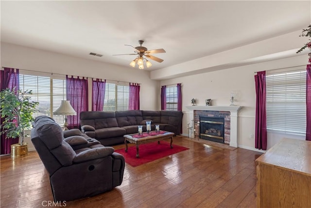 21509 Stage Dr, Tehachapi, CA 93561 - living room with a ceiling fan, hardwood / wood-style flooring, and a fireplace