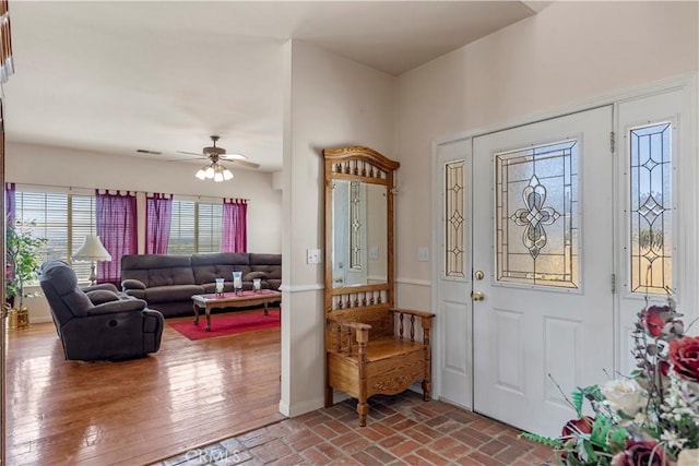 21509 Stage Dr, Tehachapi, CA 93561 - entryway featuring ceiling fan and brick flooring