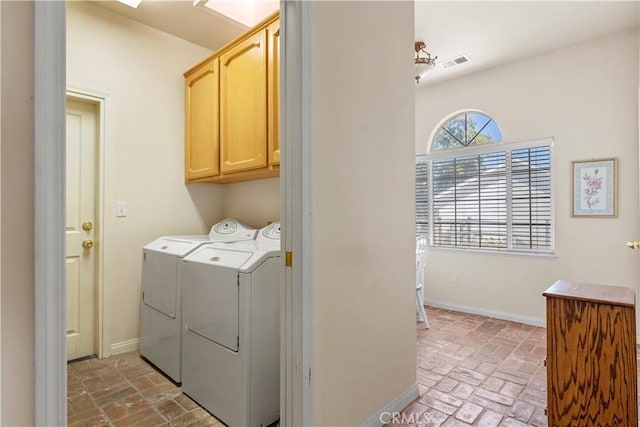 21509 Stage Dr, Tehachapi, CA 93561 - laundry area featuring cabinet space, brick floors, and washing machine and dryer