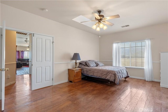 21509 Stage Dr, Tehachapi, CA 93561 - bedroom with light wood-style flooring, multiple windows, and a ceiling fan
