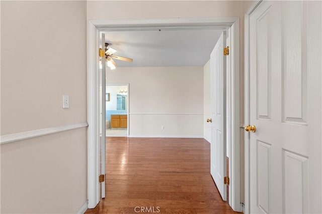 21509 Stage Dr, Tehachapi, CA 93561 - corridor featuring wood finished floors and baseboards