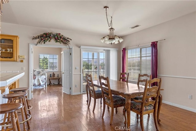 21509 Stage Dr, Tehachapi, CA 93561 - dining area featuring wood-type flooring and a chandelier
