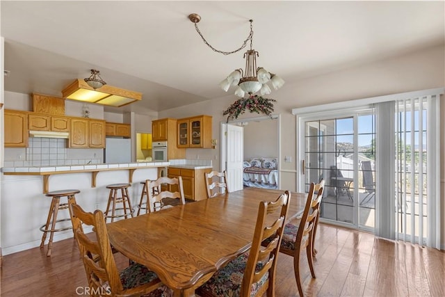 21509 Stage Dr, Tehachapi, CA 93561 - dining area featuring a chandelier and light wood-style flooring