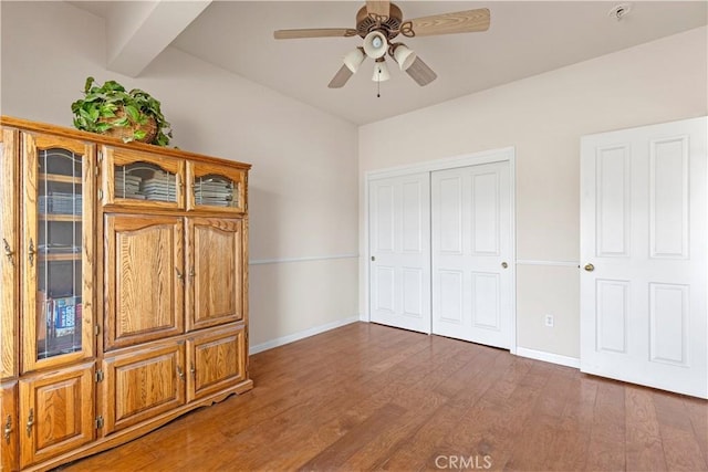 21509 Stage Dr, Tehachapi, CA 93561 - unfurnished bedroom featuring wood finished floors, a closet, and ceiling fan