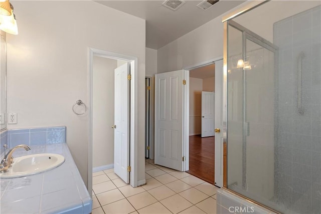 21509 Stage Dr, Tehachapi, CA 93561 - full bathroom featuring a stall shower, tile patterned flooring, and vanity