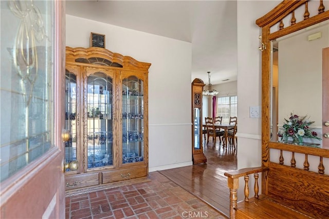 21509 Stage Dr, Tehachapi, CA 93561 - foyer with a chandelier and brick patterned floors