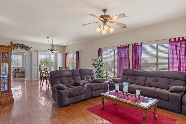 21509 Stage Dr, Tehachapi, CA 93561 - living room with plenty of natural light, a chandelier, ceiling fan, and wood finished floors