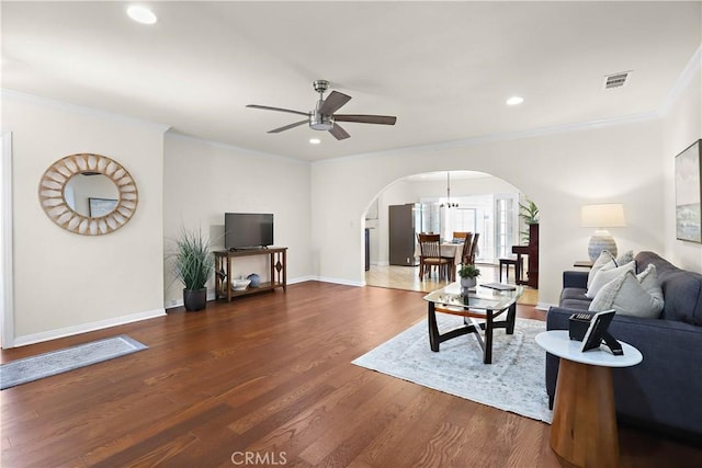 5066 N Nearglen Ave, Covina, CA 91724 - living area featuring arched walkways, ornamental molding, dark wood-style flooring, ceiling fan, and recessed lighting