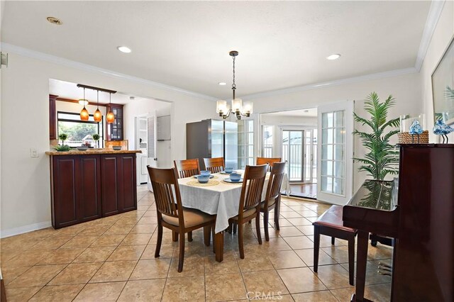 5066 N Nearglen Ave, Covina, CA 91724 - dining space featuring a chandelier, light tile patterned flooring, recessed lighting, and ornamental molding