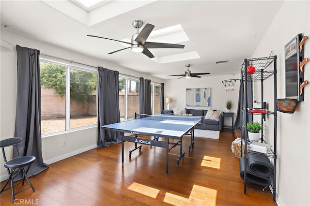 5066 N Nearglen Ave, Covina, CA 91724 - game room with a skylight, ceiling fan, and wood finished floors