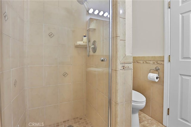 5066 N Nearglen Ave, Covina, CA 91724 - full bathroom with a shower stall, tile walls, a wainscoted wall, and tile patterned floors