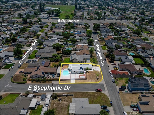 5066 N Nearglen Ave, Covina, CA 91724 - aerial perspective of suburban area with property boundaries highlighted and a pool
