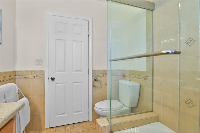 5066 N Nearglen Ave, Covina, CA 91724 - full bath with tile walls, vanity, tile patterned flooring, a wainscoted wall, and a tub to relax in